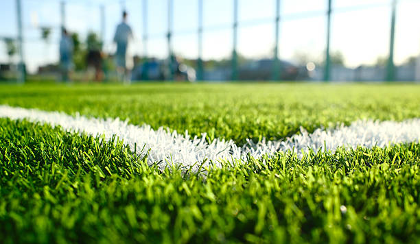 istock artificial green turf with white painted sports field boundary lines 2217602029