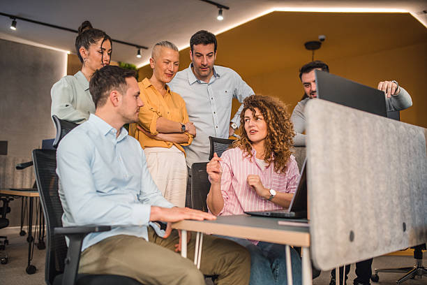 istock A smaller group of people discuss the development of a business plan while working as a team in a co-working space 2217603426