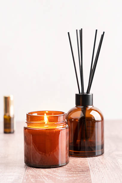 istock Glowing scented candle and aroma reed diffuser for wellness aromatherapy relaxation and home fragrance 2217603441