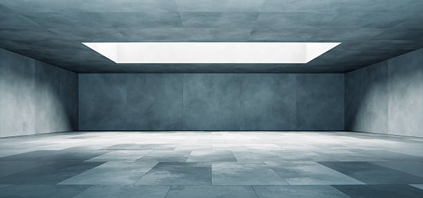 istock Modern empty concrete room interior with podium and natural skylight 2217606497