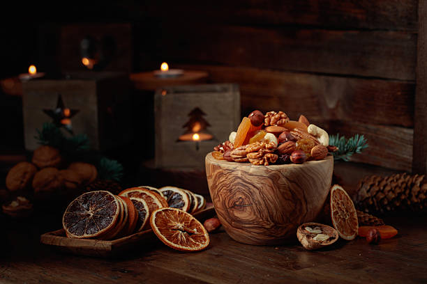 istock Dried fruits and assorted nuts on an old wooden table. 2217607891