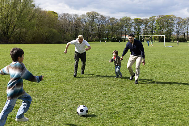 istock Family Fun Playing Football 2217611755