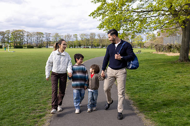 istock Family Walk Through The Park 2217611936