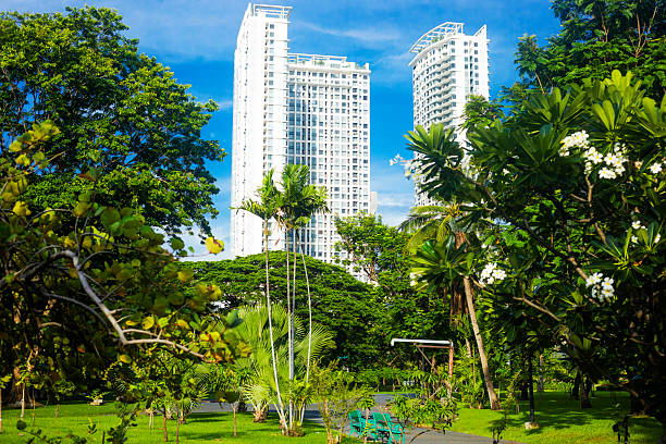 istock Tall white apartment tower blocks behind Chatichak Park 2217612359