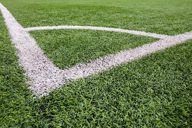 istock Football (soccer) field with new bright artificial surface. Corner marking. Training areas with small goals. Perfect solution that does not require maintenance in regions with water shortage. 2217613327