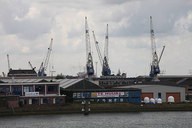 Rotterdam, the Netherlands - 08 14 2016: Cargo containers freight transportation in port Rotterdam, Netherlands. Rotterdam port can accomodate the largest cargo container ships in the world.