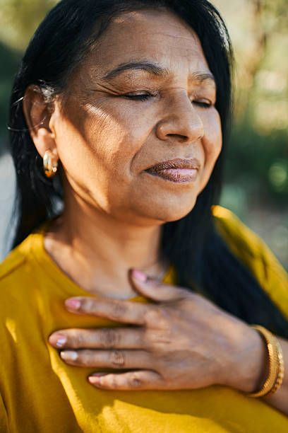 istock Serene Middle-Aged Woman Enjoying a Peaceful Moment 2217615732