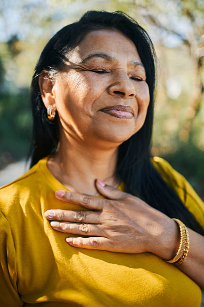 istock Serene Middle-Aged Woman Enjoying a Peaceful Moment 2217615736