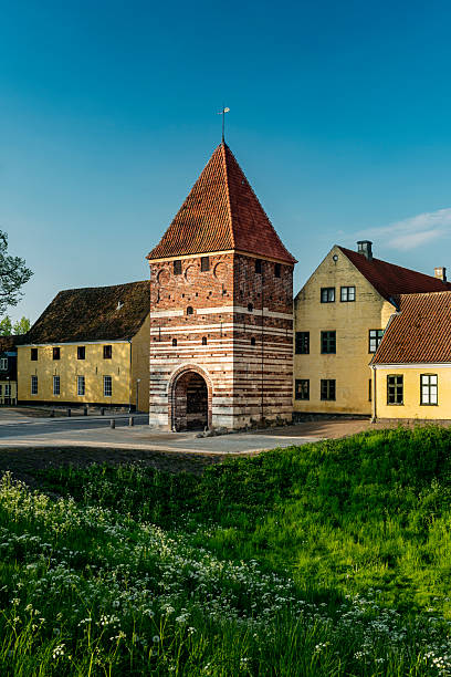 The medieval town of Stege, with the recently refurbished Gatehouse, or in Danish, “Mølleporten”, in the foreground. The Gatehouse is the only one of three that originally stood on the city walls that once guarded the town. Large parts of the moat and earth ramparts still surround the town. The tower dates back to the 16th century and is one of two that remain standing in all of Denmark.