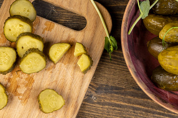 istock cut green cucumbers marinated with salt , pickled cucumbers during cooking 2217624158