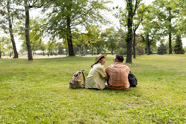 Senior woman relaxing outdoors, on a clear summer day. Lots of copy space.