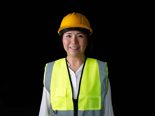 istock factory woman workers or technicians civil Engineer or Architecture project management smile at camera. 2217626387