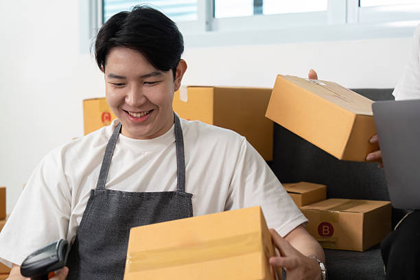 istock Couple managing inventory together in a friendly work environment. 2217626579