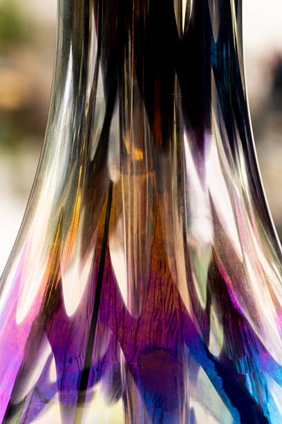 Abstract pattern of iridescent multicolored glass, colored reflections on glass surface