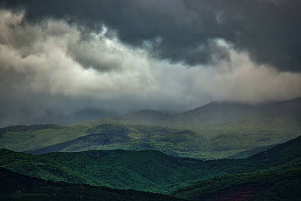 Heavy rain clouds above the mountain peaks of Mount Jahorina