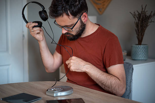 istock Retro vibes: remembering the 2000s with an old mini CD player and headphones 2217631340