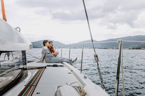 istock Young casually clothed romantic couple bonding during yachting 2217633351