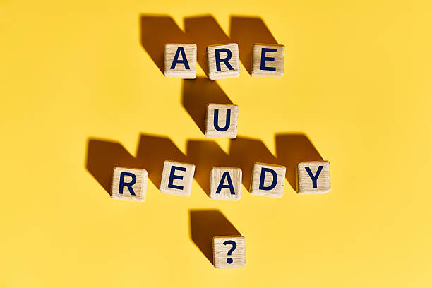 istock Are You Ready question on wooden blocks over bright yellow background 2217636934