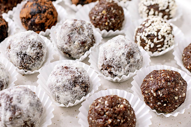 istock Assorted raw vegan balls Truffles in Paper Cups 2217637331