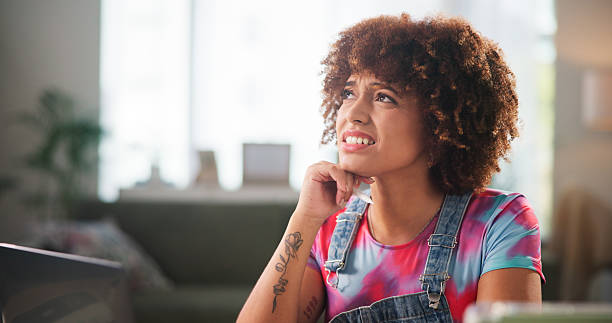 istock Thinking, business and woman in workspace, doubt and research for ecommerce, decision and questions. Person, laptop and entrepreneur with choice, expression and confused with problem solving 2217639662