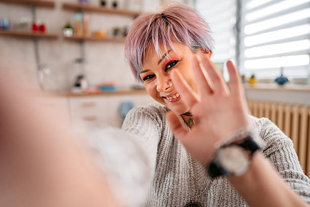 istock Young Woman Having A Video Call On The Sofa At Home 2217639918