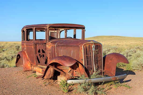 The Route 66 Monument in Petrified Forest National Park, Arizona, features a rusted 1932 Studebaker car body.