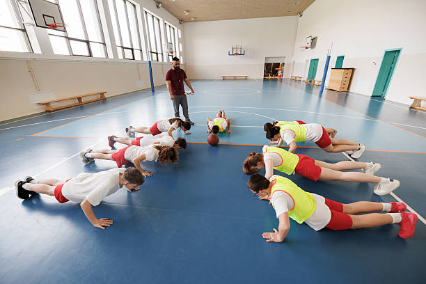 istock Group of children doing push ups at the training class 2217640515