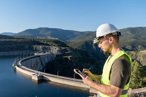 istock Engineer inspecting a hydroelectric dam for renewable energy 2217640937