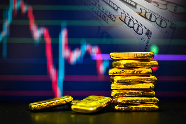 istock Gold bars the candlestick chart and US dollar background 2217642150