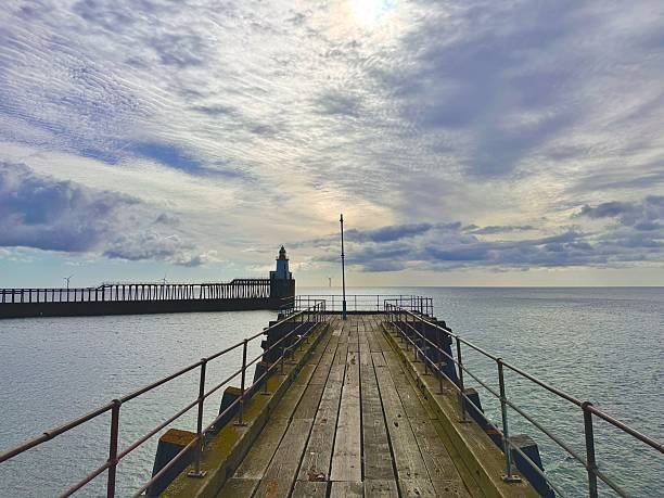 istock An empty wooden pier against cloudscape at Blyth in Northumberland 2217643089