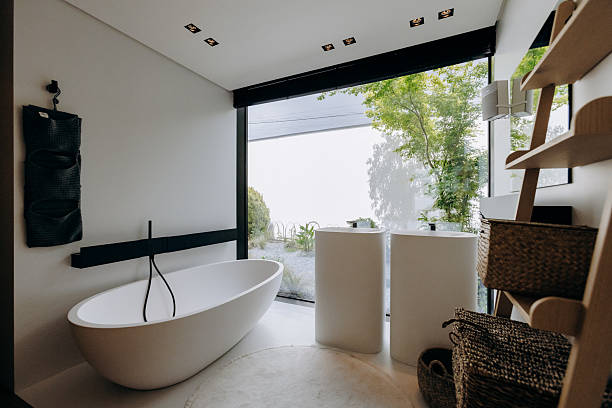 istock This is a bathroom that contains a tub, a sink, a mirror, and a ladder 2217644264