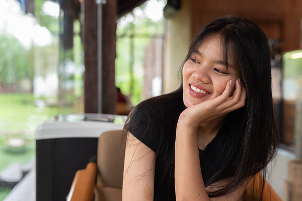 istock Young beautiful Asian woman in cafe 2217644946