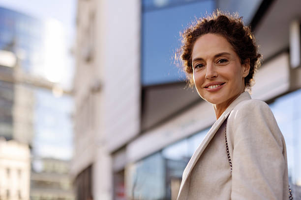 istock Empowered Woman in Urban Setting Reflecting Success and Strength 2217644989