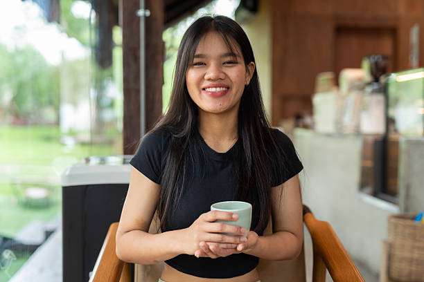 istock Young beautiful Asian woman in cafe 2217645114