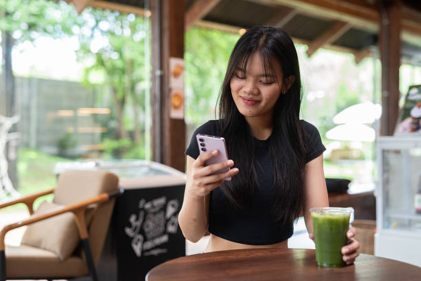 istock Young beautiful Asian woman in cafe 2217645156