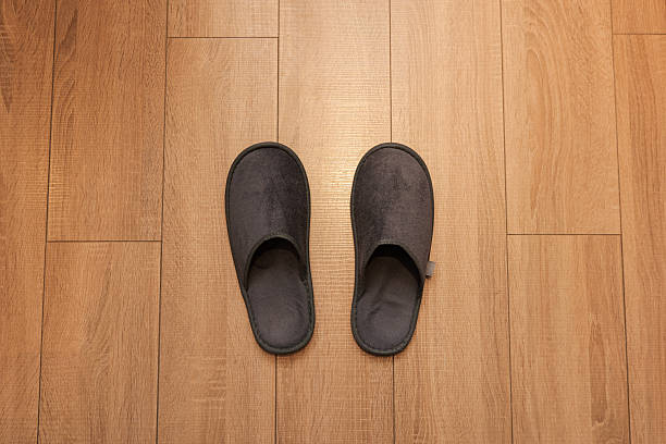 istock Slippers on the Wood Floor 2217646255