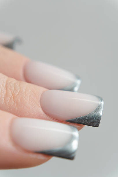 istock Contemporary nail art with metallic silver angled tips — edgy square shape and soft gel finish enhance this modern manicure. 2217646502