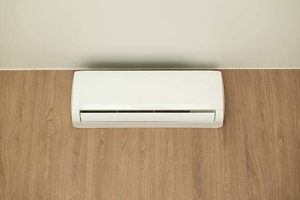 istock Air conditioner of white color on wall background, split-system in apartment 2217647848