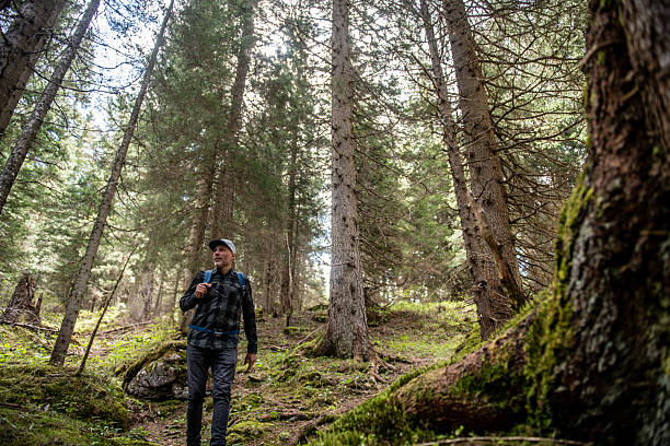 istock Man hiking in the woods 2217649067