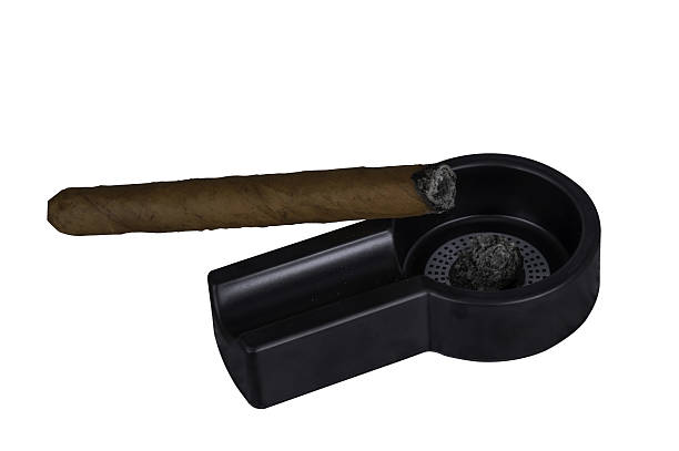 istock a lit cigar lies on an ashtray on a transparent background 2217650209
