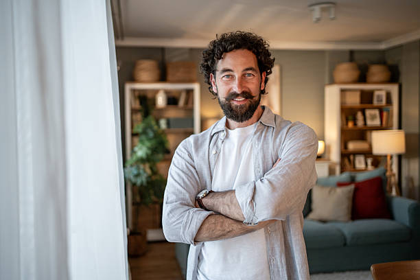 istock Confident entrepreneur smiling with crossed arms in home office 2217650262