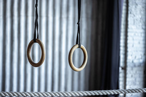 istock Wooden gymnastic rings hanging indoors with a blurred background 2217651069