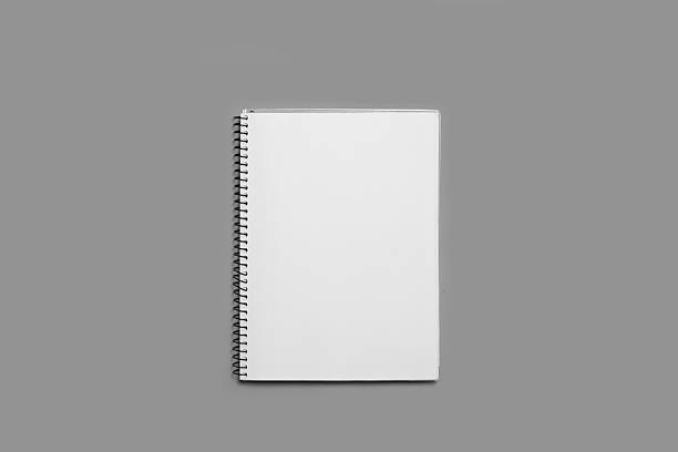istock An open notebook on a blank white page on a gray background with copy space 2217654096