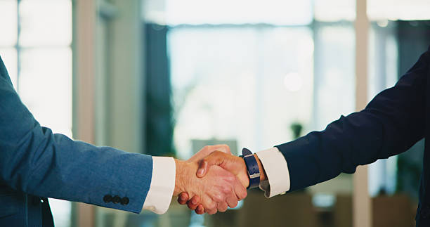 istock Handshake, welcome and business people with teamwork, success and networking in office. B2b, shaking hands and professional employee with thank you, greeting and recruitment for onboarding at company 2217654272