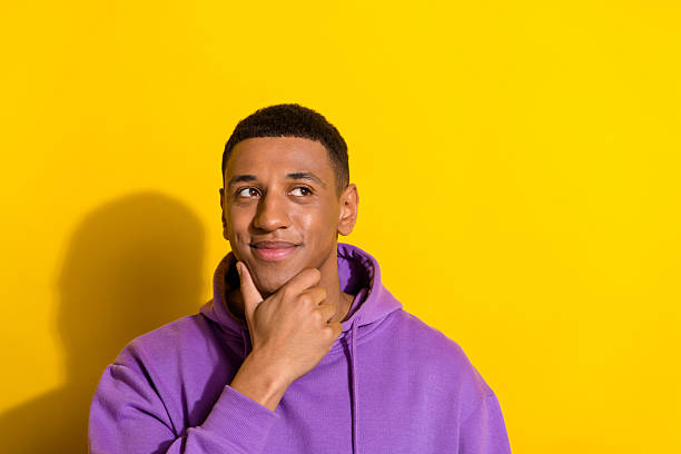 istock Portrait of attractive minded smart clever brunet guy creating solution copy space isolated over vibrant yellow color background 2217655295