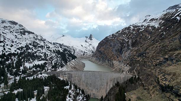 istock Snow-Capped Mountains and Dam 2217656912