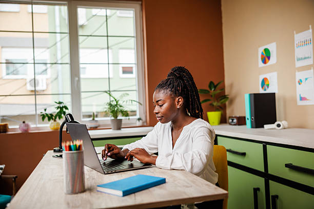 istock Focused Woman in Modern Office Environment 2217657574