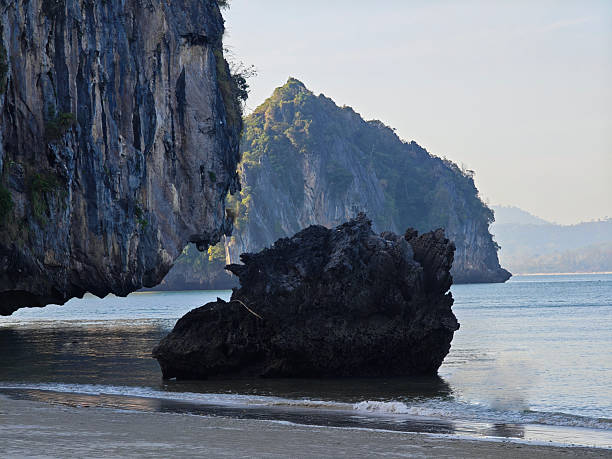 istock Rocks in the sea water and clean beach 2217658097