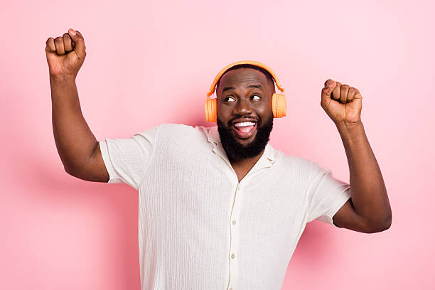 istock Photo of dreamy lucky guy dressed white shirt dancing looking empty space copyspace isolated pink color background 2217658506