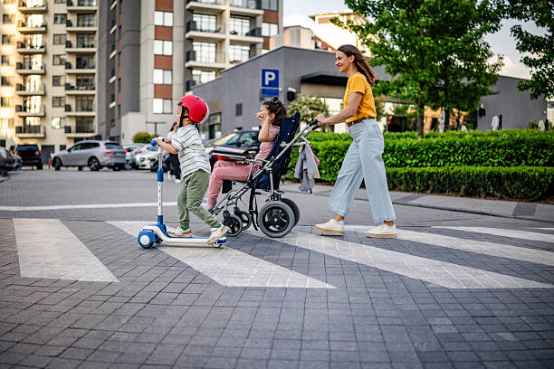 istock Family Crossing Road in Everyday Setting 2217658577